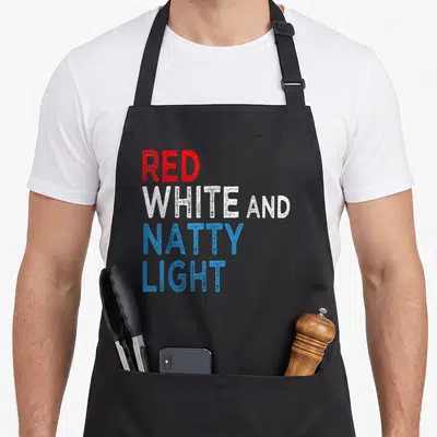 Amusing beer apron - Stacked red white and blue text reading Red White and Natty Light — shown on a black cotton canvas apron against a white background