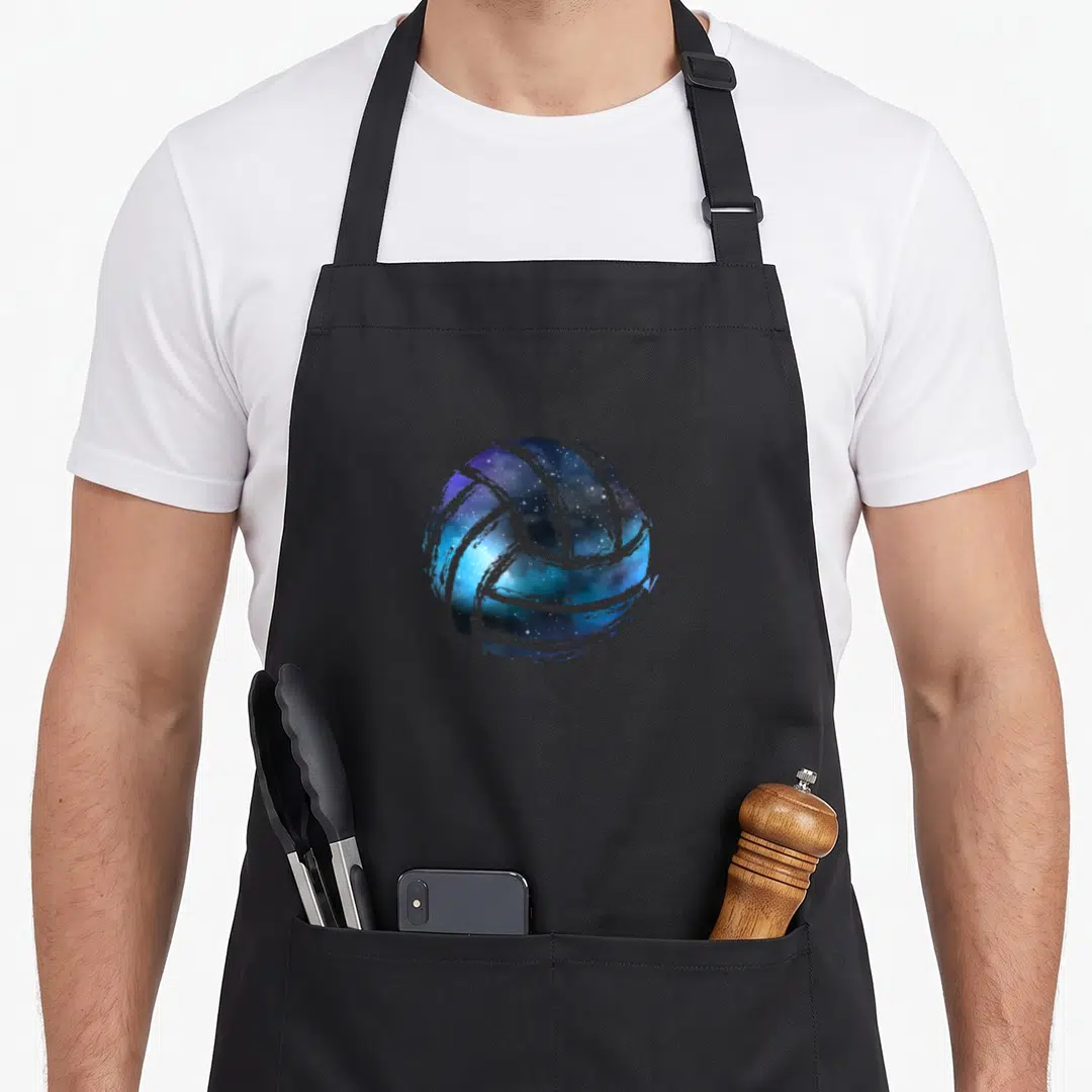 Volleyball beach sports team aprons - Watercolor volleyball filled with blue and purple galaxy texture — shown on a black cotton canvas apron against a white background