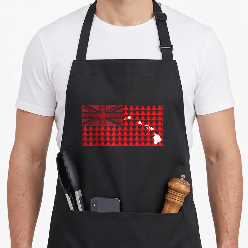 Tribal hawaiian apron - Red and white geometric flag with Union Jack and white island silhouettes on black background — shown on a black cotton canvas apron against a white background