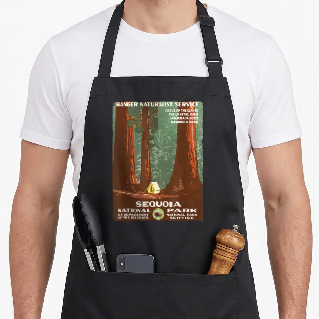 Poster national park apron - Vintage Sequoia National Park poster art with sequoia trees, small tent, and activity list — shown on a black cotton canvas apron against a white background