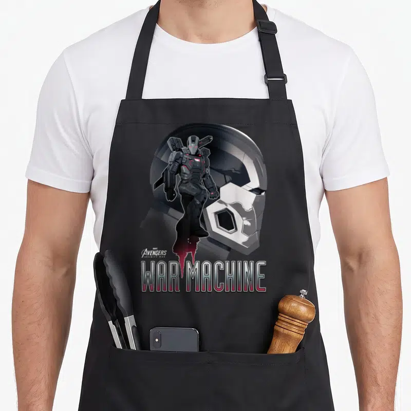 Infinity machine apron - War Machine armor figure and helmet profile with Avengers Infinity War logo text — shown on a black cotton canvas apron against a white background