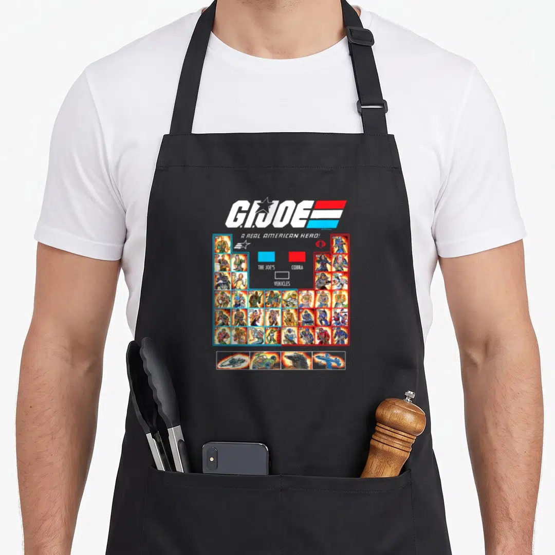 Shot collectible apron - G.I. Joe logo red white blue striped graphic character portrait grid vehicles roll call design — shown on a black cotton canvas apron against a white background