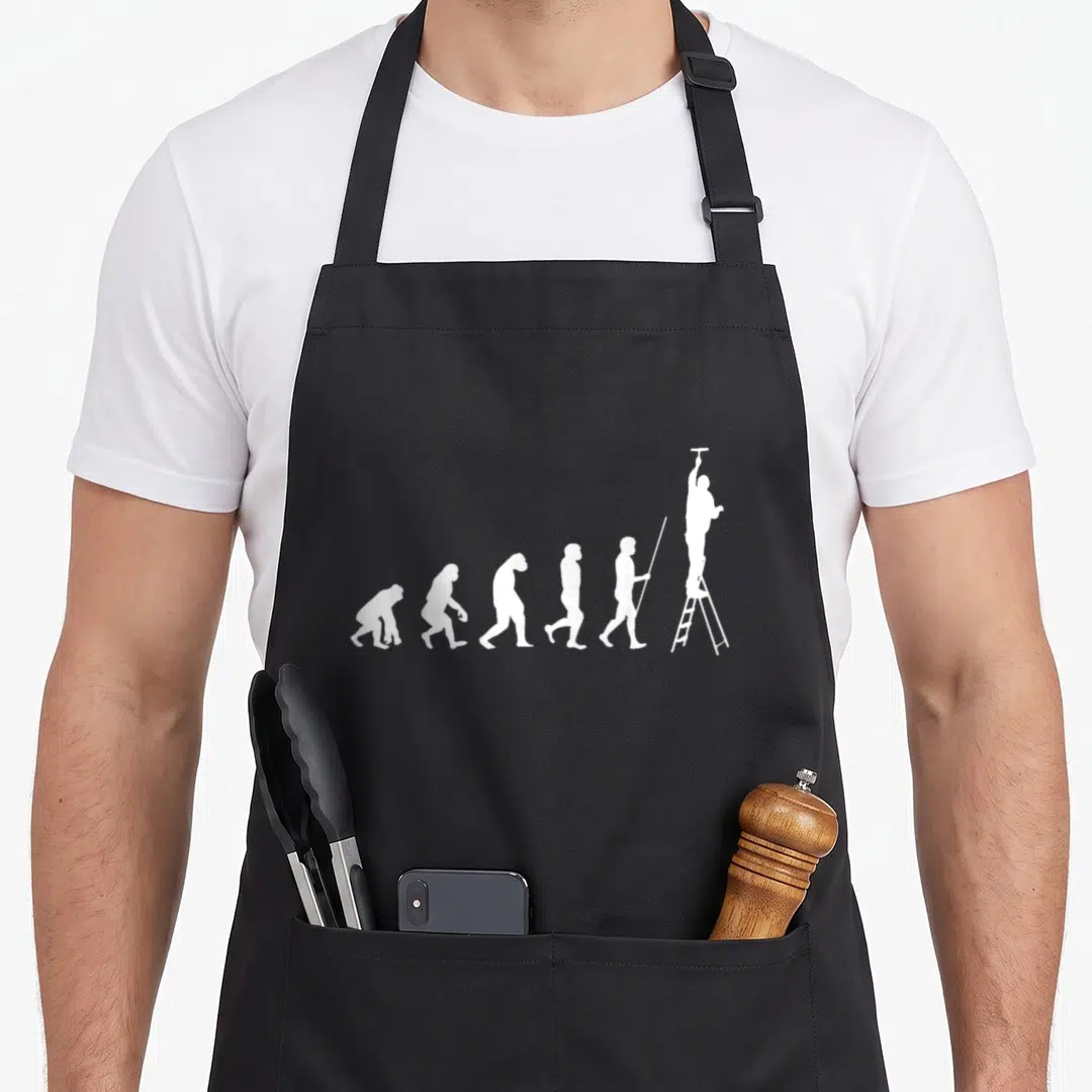 Evolution painter apron - Six white silhouettes showing evolution ending with a man on a ladder — shown on a black cotton canvas apron against a white background