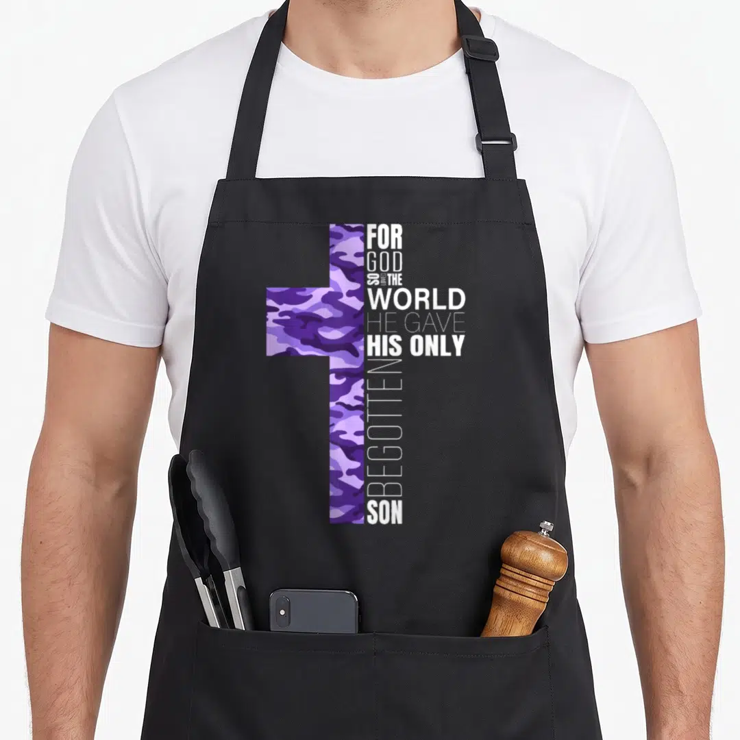 Christian camo apron - Purple camouflage cross with vertical white text FOR GOD SO LOVED THE WORLD HE GAVE HIS ONLY — shown on a black cotton canvas apron against a white background