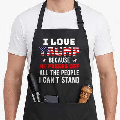 Stand novelty apron - Stacked text I Love Trump Because He Pisses Off All The People I Can't Stand with flag pattern — shown on a black cotton canvas apron against a white background