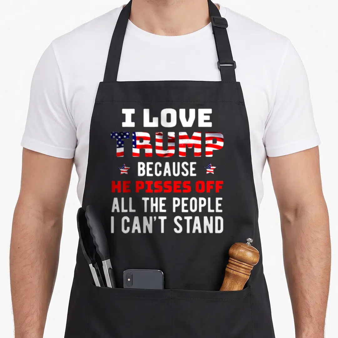 Stand novelty apron - Stacked text I Love Trump Because He Pisses Off All The People I Can't Stand with flag pattern — shown on a black cotton canvas apron against a white background
