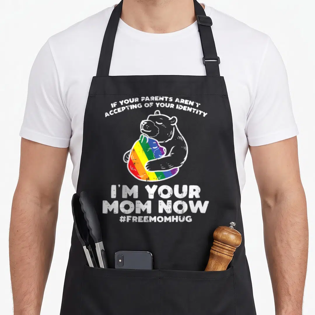 Parent cute bear apron - Cartoon bear hugging rainbow heart with text If Your Parents Aren't Accepting Of Your Identity — shown on a black cotton canvas apron against a white background