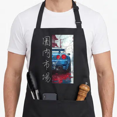 Distress japan apron - Blue car rear view with white vertical Domestic Market kanji text and red accents — shown on a black cotton canvas apron against a white background