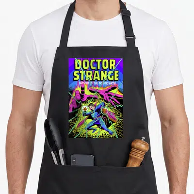 Strange doctor apron - Stacked Doctor Strange text above a figure between two purple hands with green lightning bolts — shown on a black cotton canvas apron against a white background