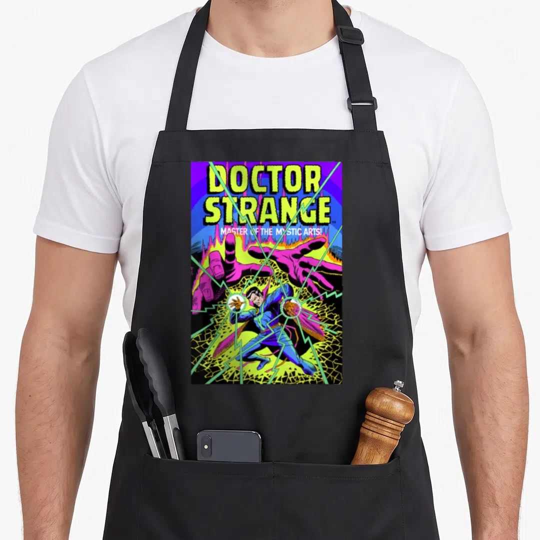 Strange doctor apron - Stacked Doctor Strange text above a figure between two purple hands with green lightning bolts — shown on a black cotton canvas apron against a white background