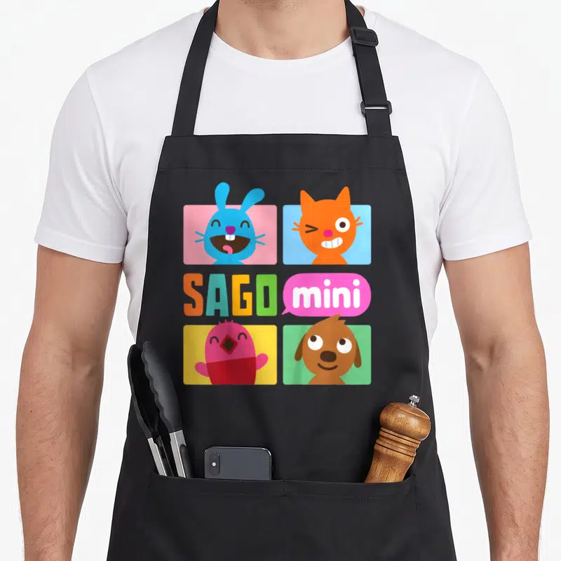 Jack robin apron - Four Sago Mini cartoon animals in colored squares with SAGO mini text logo — shown on a black cotton canvas apron against a white background