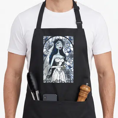 Corpse stained apron - Cartoon bride in white dress before blue stained glass window with grey butterflies — shown on a black cotton canvas apron against a white background