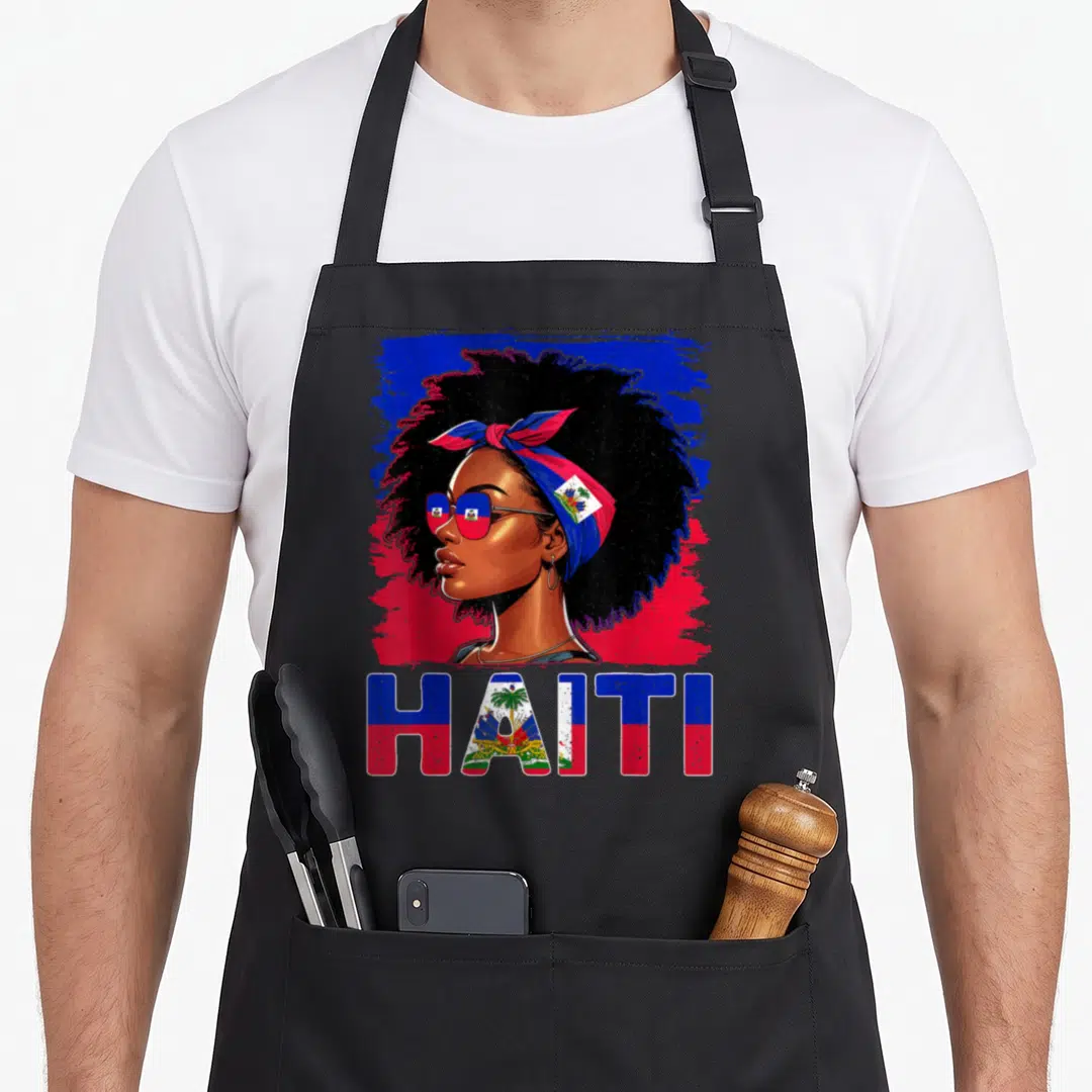 Haitienne haitian apron - Cartoon woman portrait with HAITI text filled in blue and red flag pattern — shown on a black cotton canvas apron against a white background