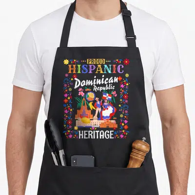 Latin heritage aprons - Proud Hispanic Dominican Republic Heritage print with flag, traditional figures, turtle — shown on a black cotton canvas apron against a white background