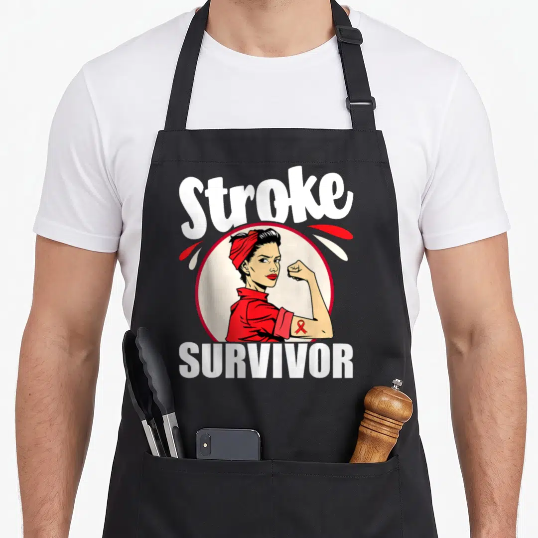 Stroke survivor ribbon apron - Cartoon woman with red scarf and awareness ribbon under white Stroke SURVIVOR text — shown on a black cotton canvas apron against a white background