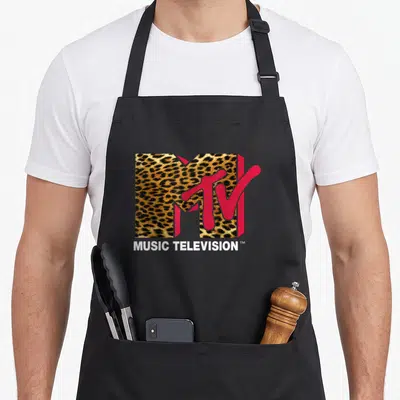 Cute mtv leopard print apron - Leopard print M logo with red TV overlay and white MUSIC TELEVISION text below — shown on a black cotton canvas apron against a white background