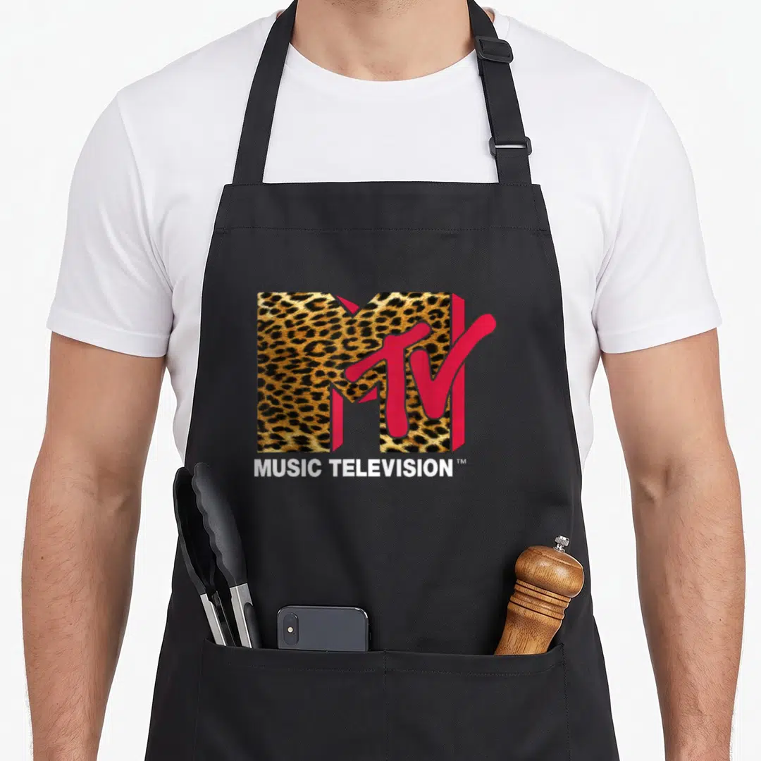 Cute mtv leopard print apron - Leopard print M logo with red TV overlay and white MUSIC TELEVISION text below — shown on a black cotton canvas apron against a white background