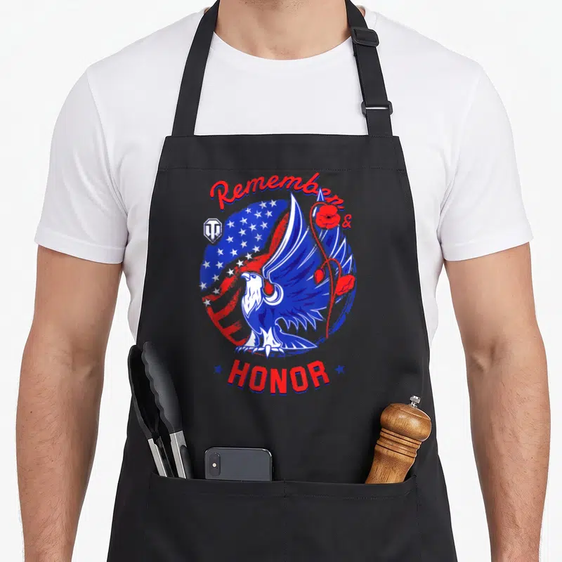 Remember memorial day apron - Eagle and honor design with red white blue stars and poppies — shown on a black cotton canvas apron against a white background