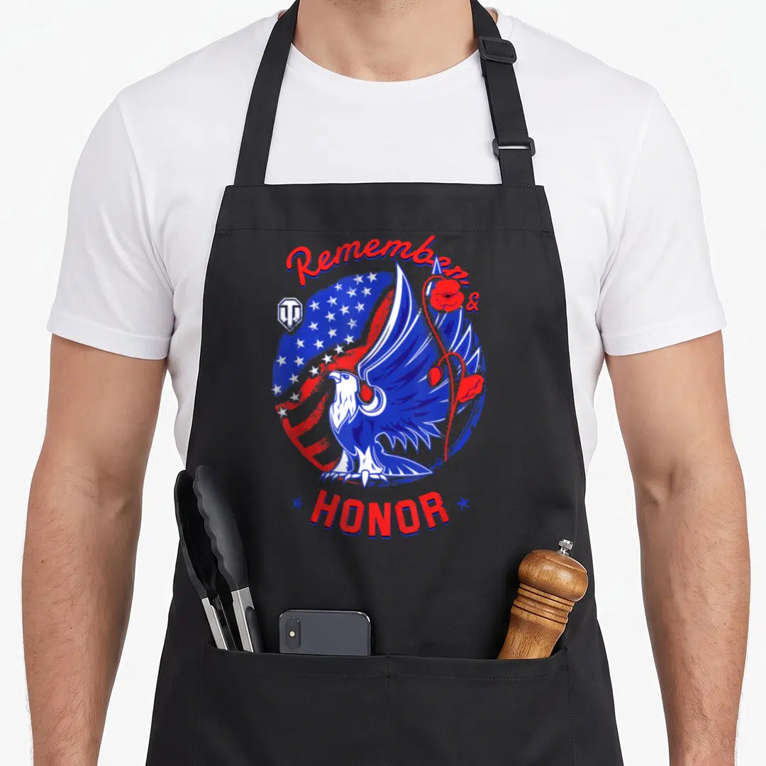 Remember memorial day apron - Eagle and honor design with red white blue stars and poppies — shown on a black cotton canvas apron against a white background