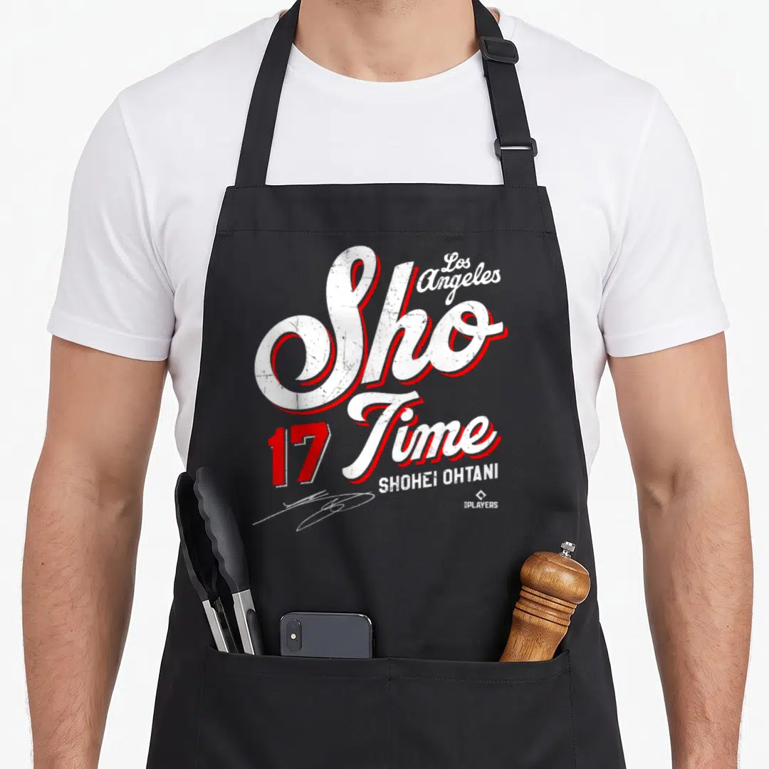 Mlboht3002 baseball apron - Sho Time typography with 17 and Shohei Ohtani name in white and red distressed style — shown on a black cotton canvas apron against a white background