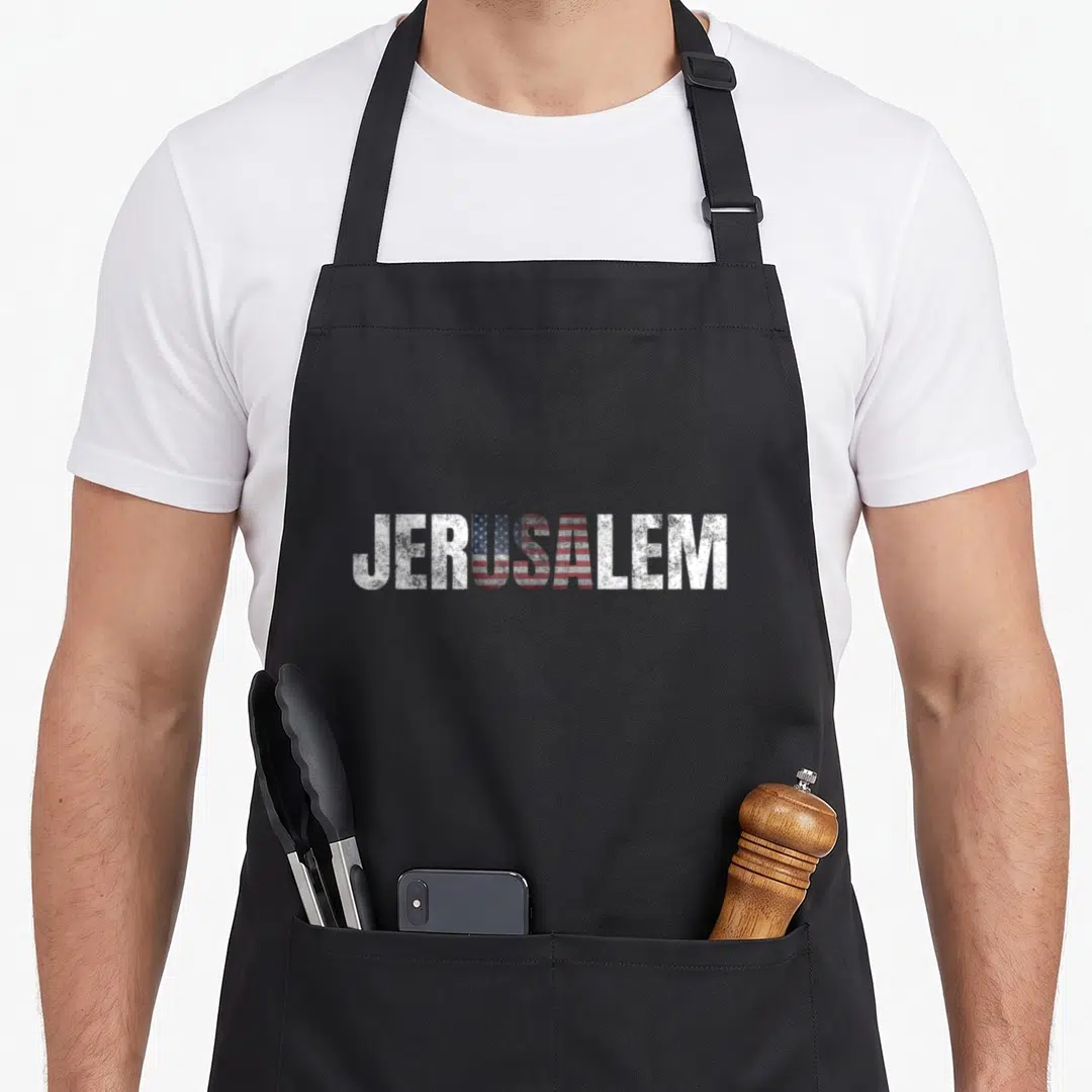Jerusalem american flag apron - JERUSALEM text with distressed US flag pattern in red white blue — shown on a black cotton canvas apron against a white background