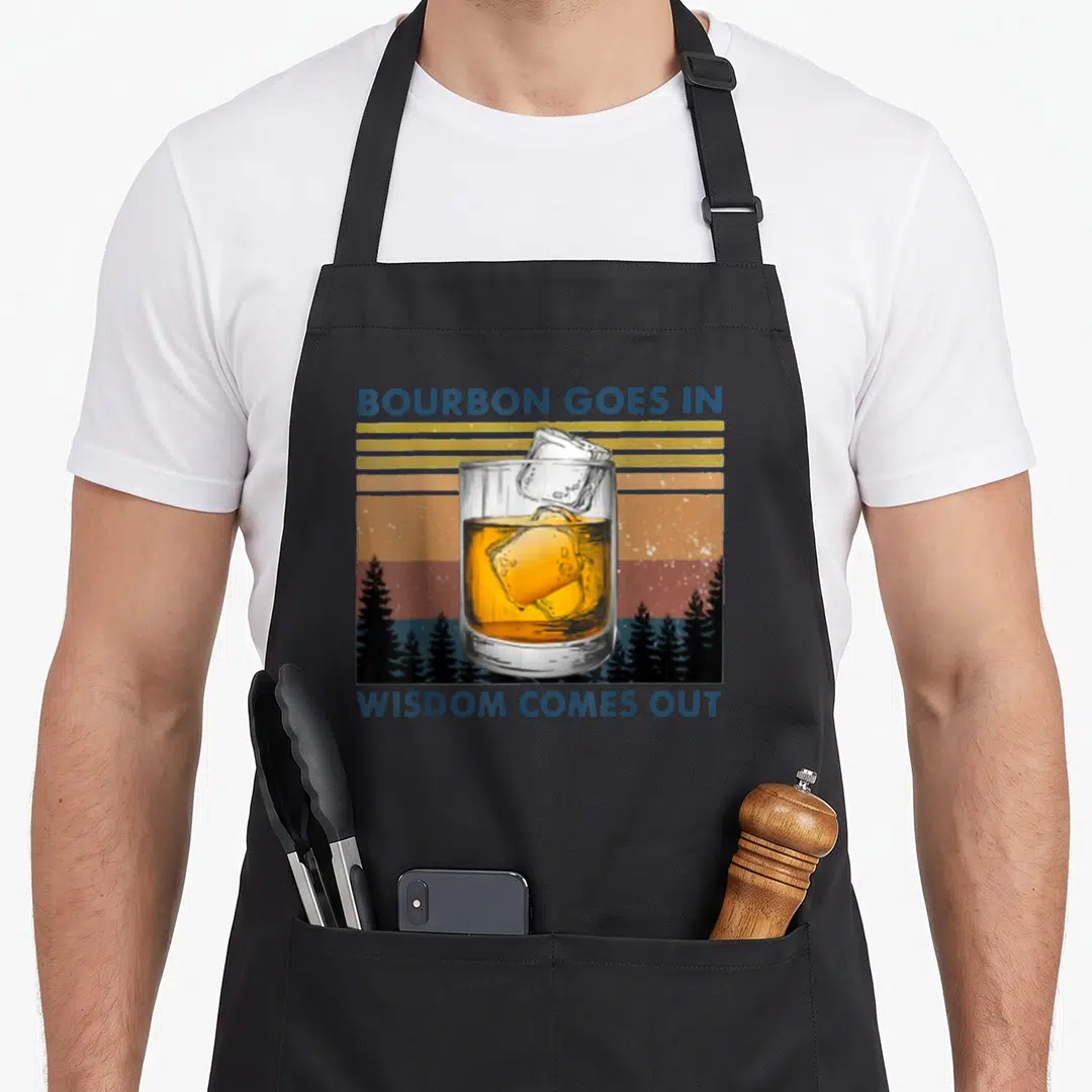 Wisdom bourbon apron - Retro glass of bourbon over sunset stripes with blue text BOURBON GOES IN WISDOM COMES OUT — shown on a black cotton canvas apron against a white background