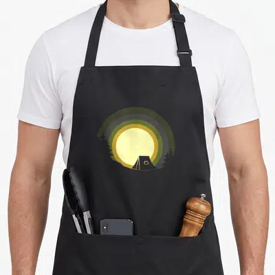 Outdoor hiking backpacking camping apron - Minimalist tent and sun graphic in olive, green, yellow, and grey with pine — shown on a black cotton canvas apron against a white background