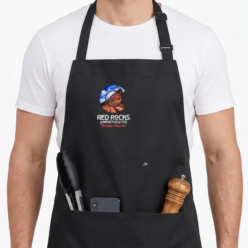 Morrison colorado apron - Red Rocks Amphitheater photo inside a C shape with text Morrison Colorado — shown on a black cotton canvas apron against a white background