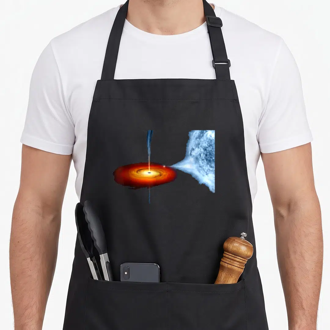 Hole science apron - Black hole with orange red disk and blue jet pulling matter from blue planet — shown on a black cotton canvas apron against a white background