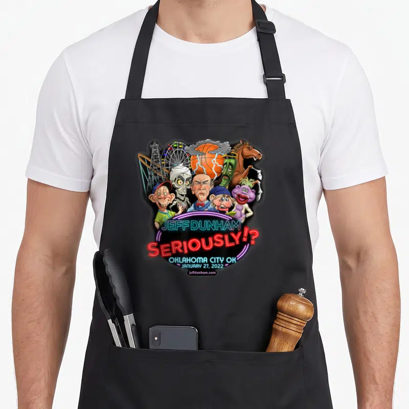 Jeff tornado apron - Jeff Dunham characters basketball storm neon text Oklahoma City 2022 — shown on a black cotton canvas apron against a white background