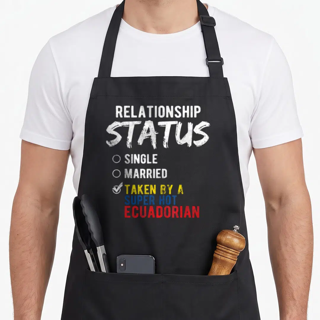 Relationship ecuadorian apron - Stacked text RELATIONSHIP STATUS with checked option TAKEN BY A SUPER HOT ECUADORIAN — shown on a black cotton canvas apron against a white background