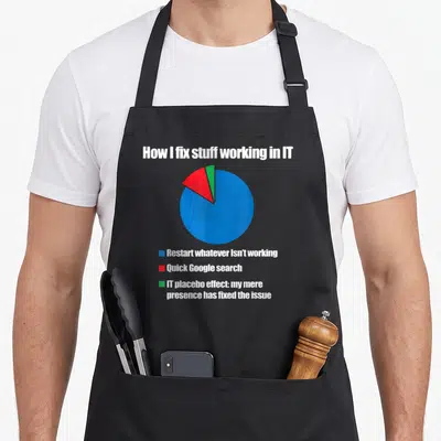 Technology nerd apron - Pie chart titled How I fix stuff working in IT showing restarts as the primary solution — shown on a black cotton canvas apron against a white background