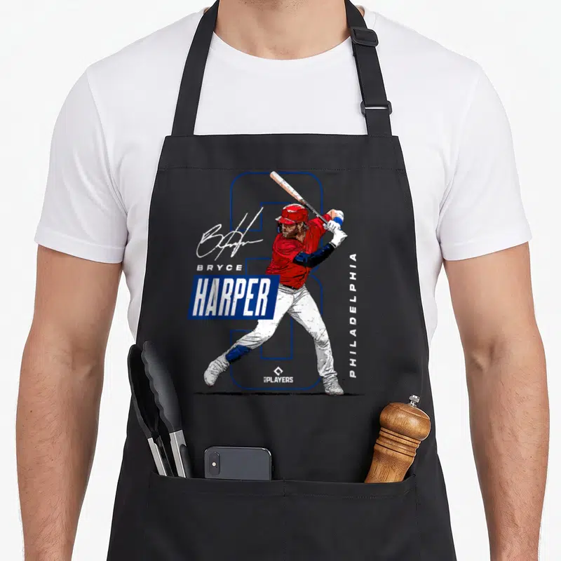 Bryce philadelphia apron - Realistic batter in red jersey overlapping blue number 3 outline with Bryce Harper — shown on a black cotton canvas apron against a white background
