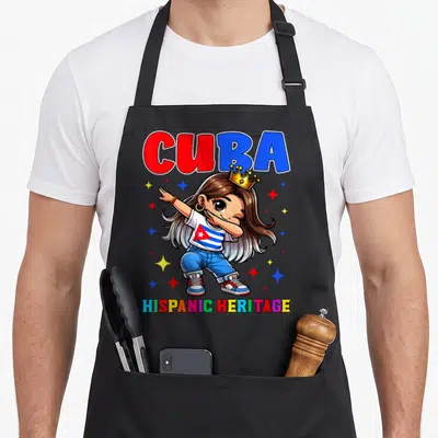 Celebration hispanic aprons - Cartoon girl dabbing wearing flag shirt under CUBA and HISPANIC HERITAGE text with stars — shown on a black cotton canvas apron against a white background
