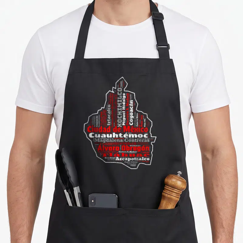 Cdmx mexico apron - Red and white word cloud map of Mexico City districts including Iztapalapa and Coyoacan — shown on a black cotton canvas apron against a white background