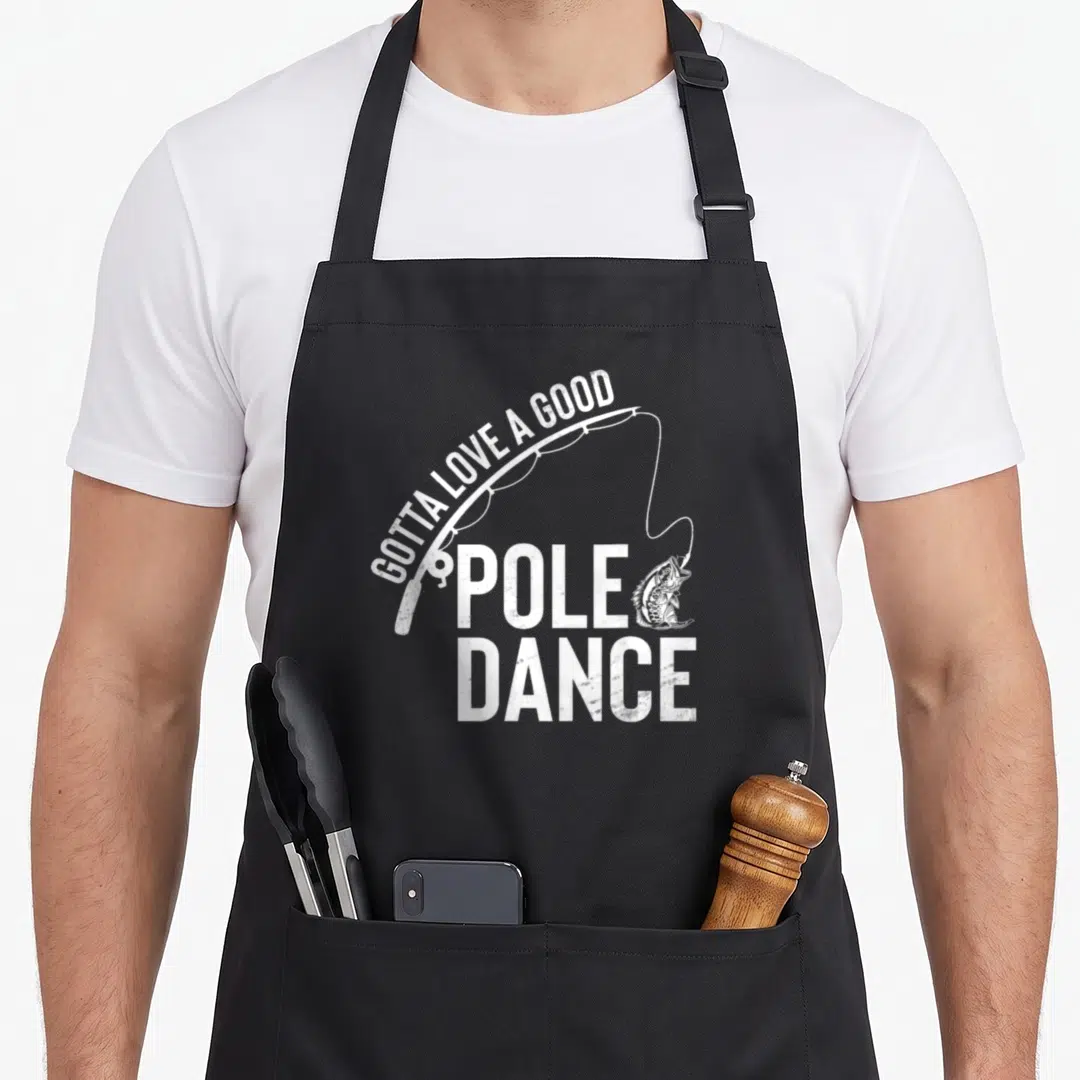 Pole dance fishing aprons - White distressed fishing rod and Gotta Love A Good Pole Dance text with hanging bass — shown on a black cotton canvas apron against a white background