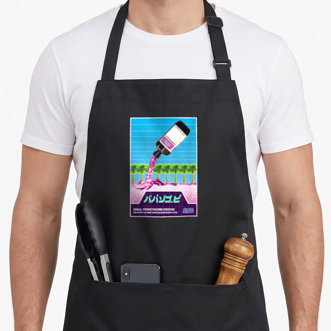 Lean spring apron - Pixel art bottle pouring pink liquid over palm trees with Japanese text and blue grid background — shown on a black cotton canvas apron against a white background