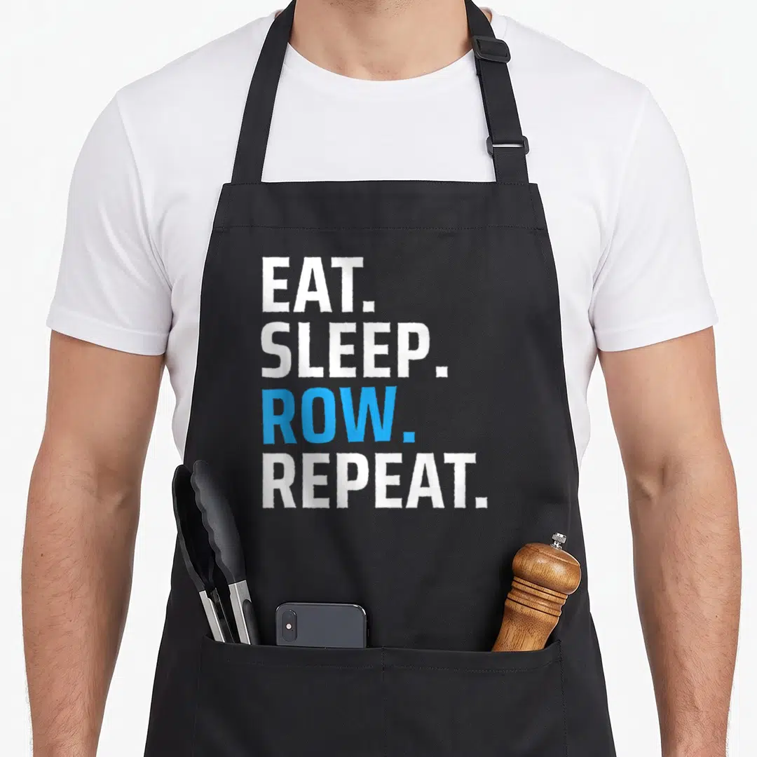 Gear crew apron - Stacked white and blue text reading EAT. SLEEP. ROW. REPEAT — shown on a black cotton canvas apron against a white background