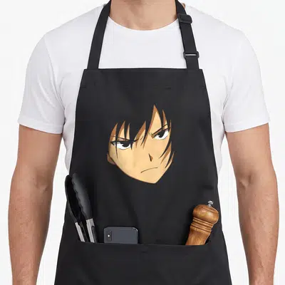 Face anime apron - Centered anime head with tan hair and brown outlines in cartoon style — shown on a black cotton canvas apron against a white background