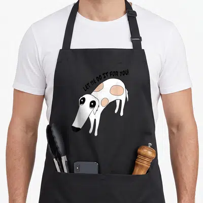Greyhound whippet dog apron - Cartoon white and tan dog with arched text LET ME DO IT FOR YOU! — shown on a black cotton canvas apron against a white background