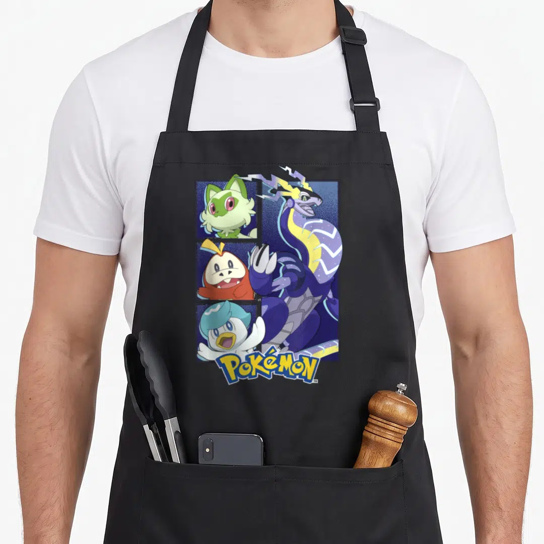 Mon poke addict apron - Four Pokemon grid with Miraidon overlapping right side, Pokemon logo bottom, yellow purple — shown on a black cotton canvas apron against a white background