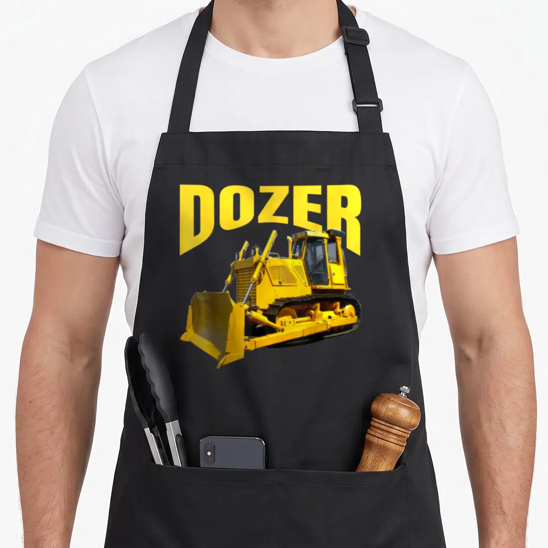 Bulldozer heavy apron - Yellow bulldozer photo with DOZER text above on black fabric — shown on a black cotton canvas apron against a white background