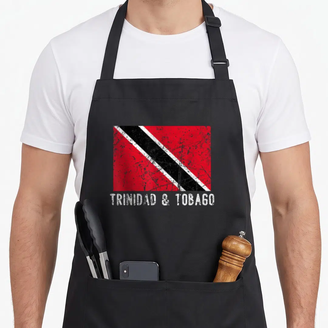Trinidad distressed apron - Distressed Trinidad and Tobago flag graphic with white text below — shown on a black cotton canvas apron against a white background