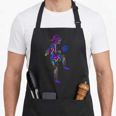 Youth soccer apron - Multicolored line art of female soccer player kicking ball in blue, yellow, red, purple outlines — shown on a black cotton canvas apron against a white background