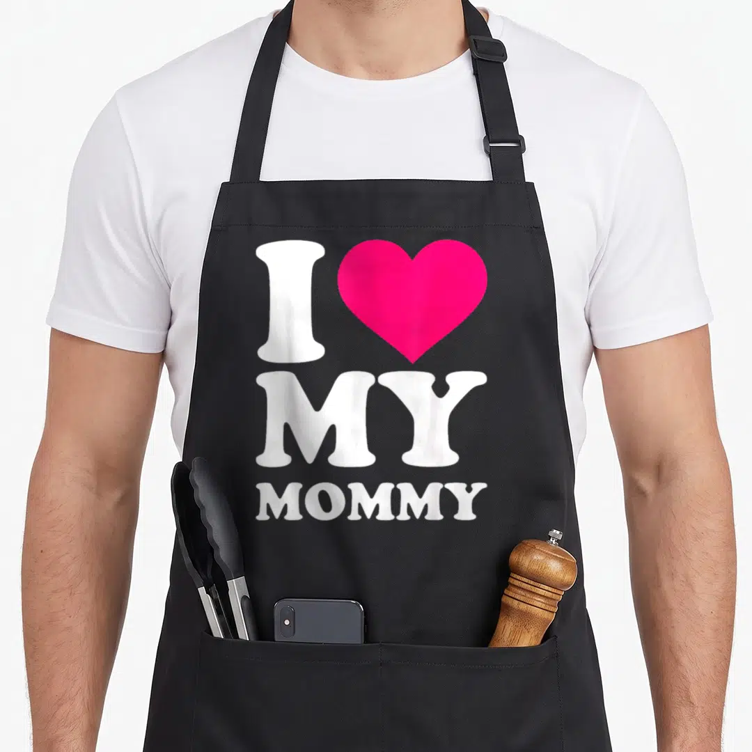 Funny gerbil mom apron - White I MY MOMMY text with pink heart on black background — shown on a black cotton canvas apron against a white background