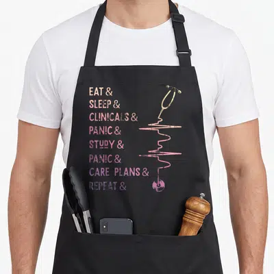 Medical nursing student apron - Stacked text EAT SLEEP CLINICALS PANIC STUDY CARE PLANS REPEAT beside a stethoscope — shown on a black cotton canvas apron against a white background