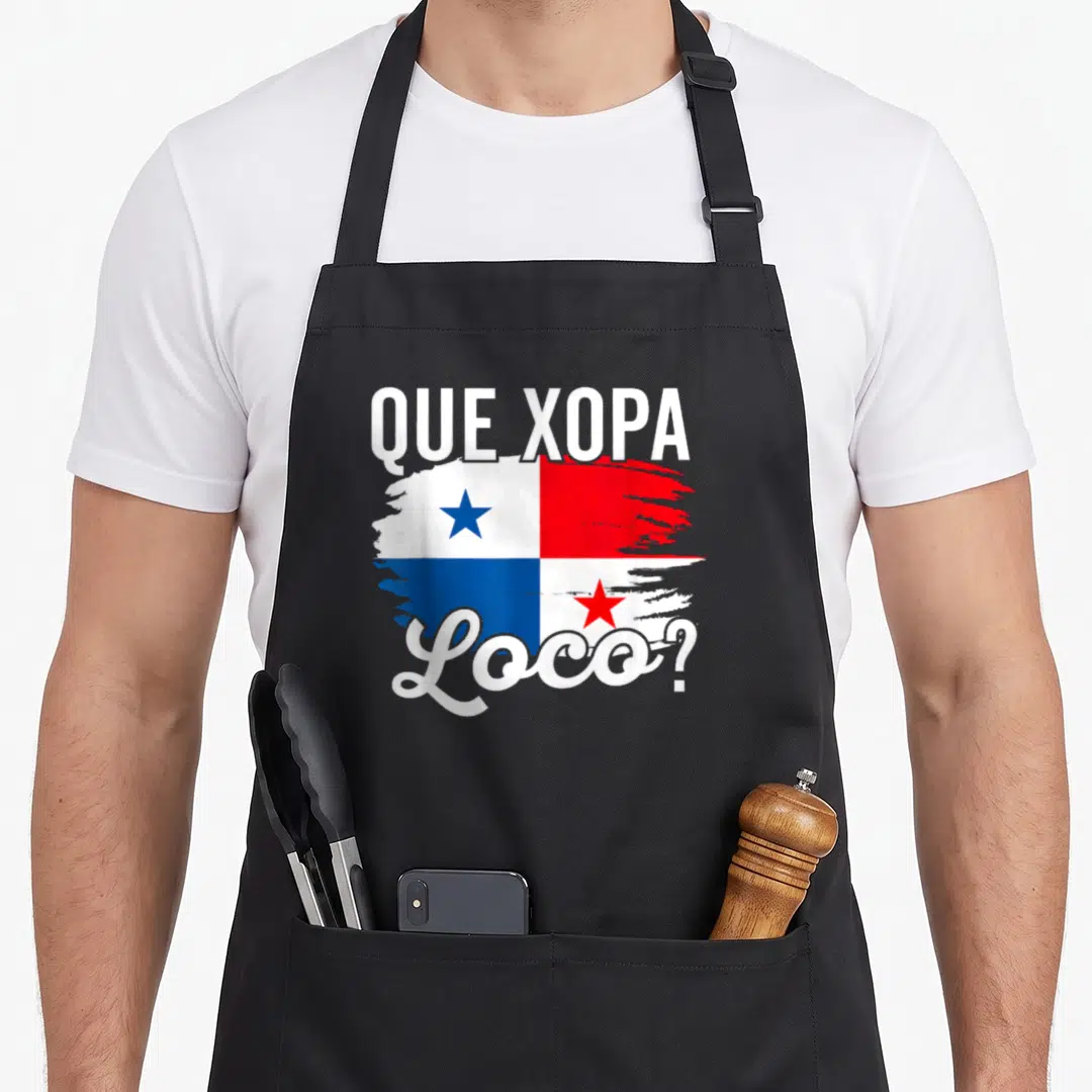 Camiseta panamanian apron - Distressed Panamanian flag with Que Xopa Loco text in white red and blue — shown on a black cotton canvas apron against a white background
