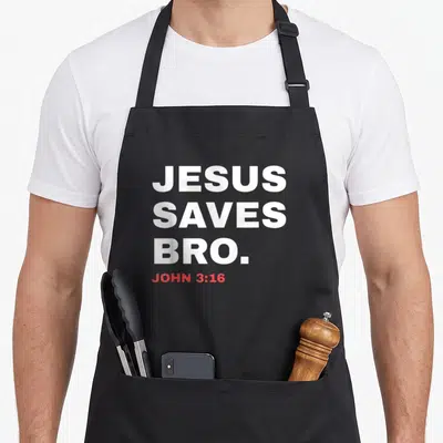 Joke christian apron - JESUS SAVES BRO. in white, JOHN 3:16 in red, stacked typography — shown on a black cotton canvas apron against a white background