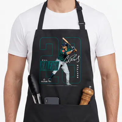 Cal seattle apron - Realistic Cal Raleigh batter with teal 29, vertical Seattle text, and white signature on black — shown on a black cotton canvas apron against a white background