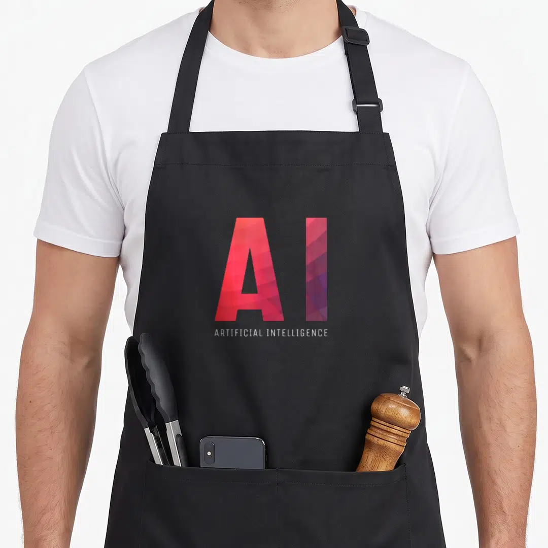 Artificial science apron - Geometric AI logo in red purple pink with white Artificial Intelligence text below — shown on a black cotton canvas apron against a white background